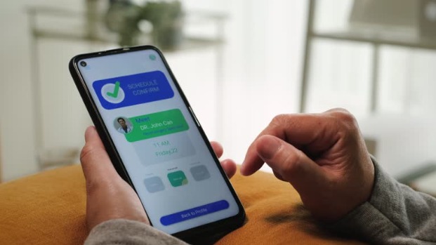 Insurance networking app showing appointment confirmation with a doctor on smartphone